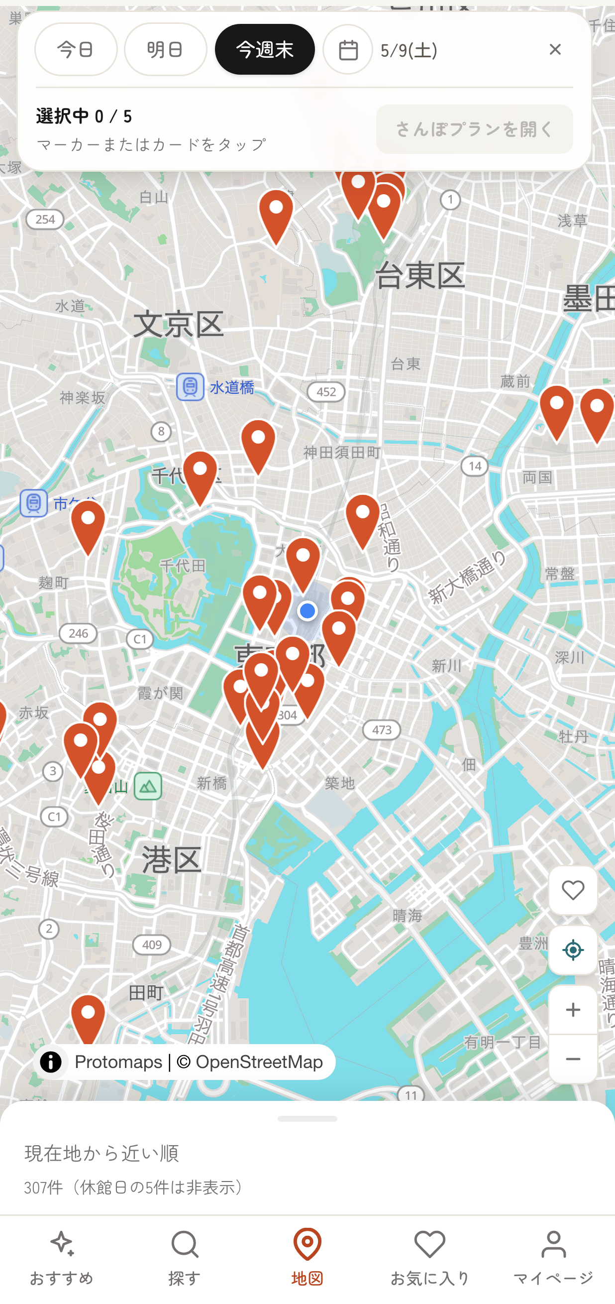 地図画面の選択モード。上部に「選択中 0 / 5」のツールバー、地図上にオレンジ色の会場ピンが並んでいる